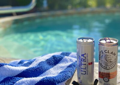 Cold drinks taste so good by the Villa's Salt Water Pool for couples in the sunny Okanagan